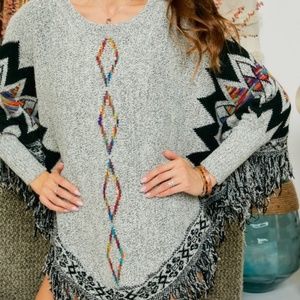 TRIBAL SWEATER PONCHO WITH FRINGES